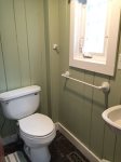 The full bath is accessed through the one bedroom